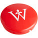 A red round faucet cap with a white letter W on it.