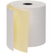 A roll of Point Plus carbonless paper with a yellow strip.