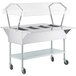 A ServIt stainless steel steam table with clear sneeze guards on both sides.