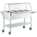 A ServIt stainless steel open well electric steam table with casters.