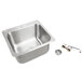 A stainless steel Advance Tabco drop-in sink with a drain.