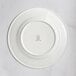 A RAK Porcelain ivory porcelain plate with an embossed crown logo.