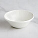 A RAK Porcelain ivory porcelain bowl with wavy lines on it.