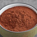 A bowl of Cacao Barry Dutched Cocoa Powder.