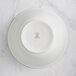 A white RAK Porcelain salad bowl with an embossed crown.