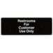 A black sign with white text that says "Restrooms For Customer Use Only"