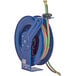 A blue Coxreels welding hose reel with a hose and cable attached.