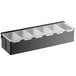 A matte black stainless steel condiment bar with six compartments.
