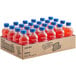 A cardboard box of Hawaiian Punch Lemon Berry Squeeze bottles with red liquid and blue caps.