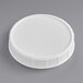 A 120 mm white plastic lid on a gray surface.
