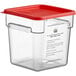 A clear plastic container with a red lid.
