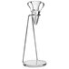 A Decantus table stand with an acrylic base holding a wine aerator over a glass.