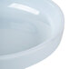 A close up of a blue jade Thunder Group melamine bowl with a round rim.
