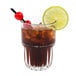 A Libbey Everest cooler glass with cola and a lime slice.