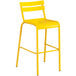 A yellow powder coated aluminum barstool with a white background.