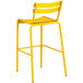 A yellow aluminum outdoor barstool with a backrest.