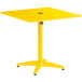 A yellow square Lancaster Table & Seating outdoor table with a metal base and umbrella hole.