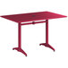 A red rectangular Lancaster Table & Seating dining table with a metal base.