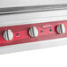 A white Avantco countertop electric griddle with red knobs.