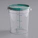 A Vigor clear plastic container with a green lid.
