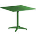 A green Lancaster Table & Seating outdoor table with a metal base and a black round top.