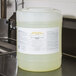 A white container of Advantage Chemicals Low Temperature Dish Washing Machine Sanitizer on a counter.