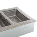 A stainless steel rectangular drop-in hot food well with four sections.