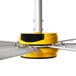 A yellow and silver Big Ass Fans ceiling fan with metal blades.