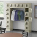 A Regency beige locker room with 16 compartments and garment rack with clothes hanging.
