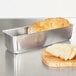 A loaf of bread in a Vollrath aluminum bread loaf pan.