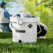 A white CaterGator outdoor cooler with a lid open containing ice and plastic bottles.