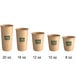 A row of brown New Roots paper hot cups with green text.