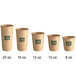 A row of New Roots brown paper hot cups with green text.