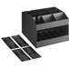 A ServSense black dual-sided countertop condiment organizer with labels on the shelves.