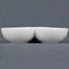 Two white CAC Super White three bowl tasting dishes stacked on a gray surface.