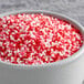 A bowl of Regal Valentine's Day red and white sprinkles.