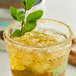 A glass of Bourbon Barrel Foods Mint Julep Sugar drink garnished with mint leaves.
