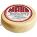 A 16 lb. wheel of Greek Kasseri cheese on a white background with a red and blue label.