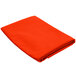 An orange folded Intedge cloth table cover on a white background.