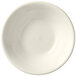 A Libbey Porcelana cream white porcelain fruit bowl with a rolled edge.