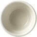 A close-up of a Libbey Porcelana white porcelain bowl with a rolled edge.
