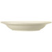 A close up of a Libbey Porcelana cream white pasta bowl with a wide rim.