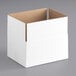 A white cardboard Lavex shipping box on a white surface.