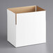 A white corrugated cardboard shipping box with a brown lid.