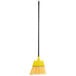 A yellow broom with a black handle.