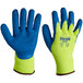A pair of yellow Cordova terry thermal gloves with blue latex palms.