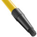 A yellow and black threaded fiberglass broom/squeegee handle.