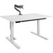 A white Bridgeport Pro-Desk with a black monitor arm on it.