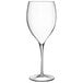 A close-up of a clear Luigi Bormioli Magnifico wine glass with a long stem.