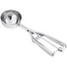 A silver round stainless steel scoop with a squeeze handle.
